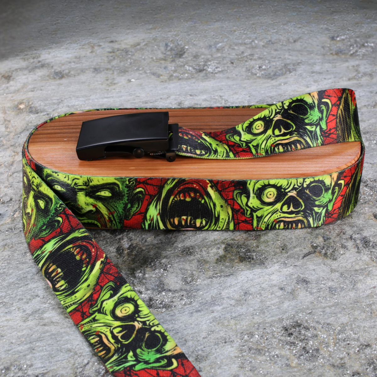 belt with colorful zombie pattern on a concrete surface
