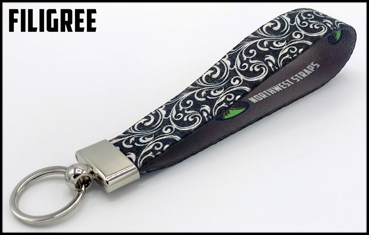 Silver filigree 1 inch custom picture quality polyester webbing keyfob. Design by Northwest Straps.