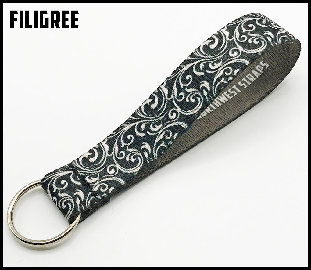 Silver filigree 1 inch custom picture quality polyester webbing keyfob. Design by Northwest Straps.