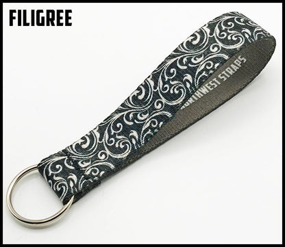Silver filigree 1 inch custom picture quality polyester webbing keyfob. Design by Northwest Straps.
