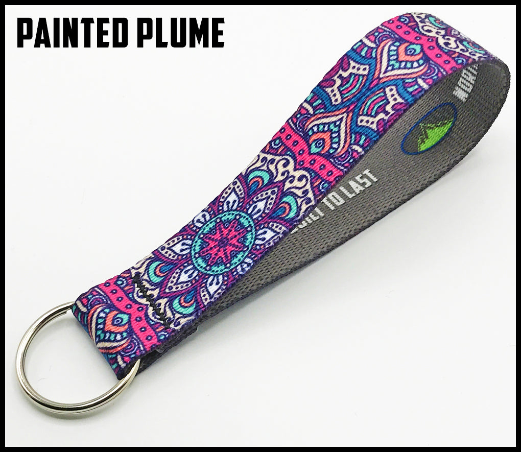 Painted plume pink white purple teal. Native design. 1 inch custom picture quality polyester webbing keyfob. Design by Northwest Straps.