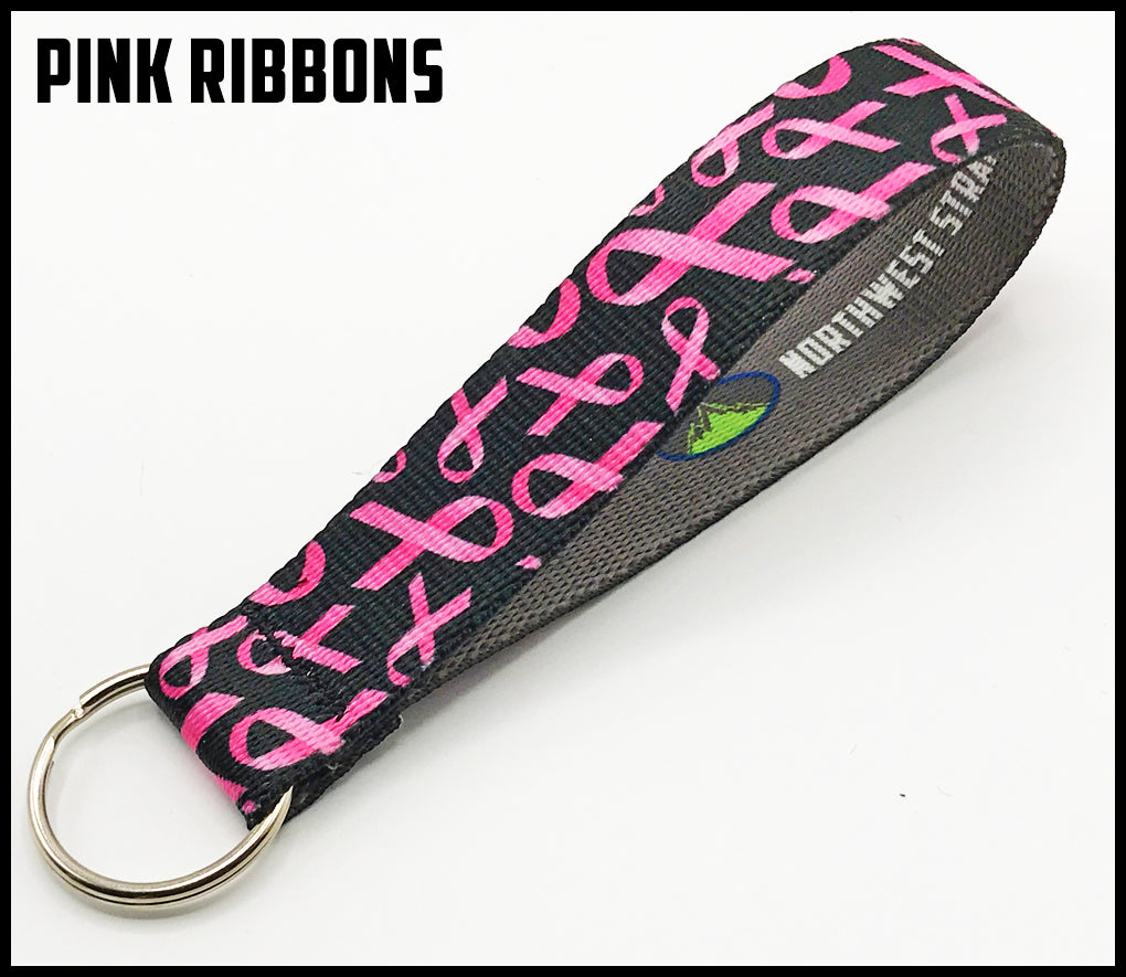 Pink ribbon on black background. 1 inch custom picture quality polyester webbing keyfob. Design by Northwest Straps.
