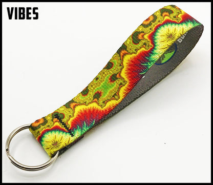 yellow red green and brown trippy. 1 inch custom picture quality polyester webbing keyfob. Design by Northwest Straps.