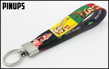 Black yellow green red background Pinup girls. 1 inch custom picture quality polyester webbing keyfob. Design by Northwest Straps.